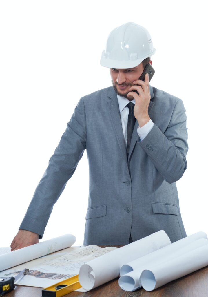 Architect talking on call phone at work place